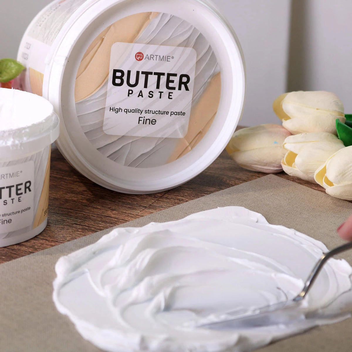 Wiaderka pasty ARTMIE Butter Fine, zbliżenie na opakowanie i wieczko